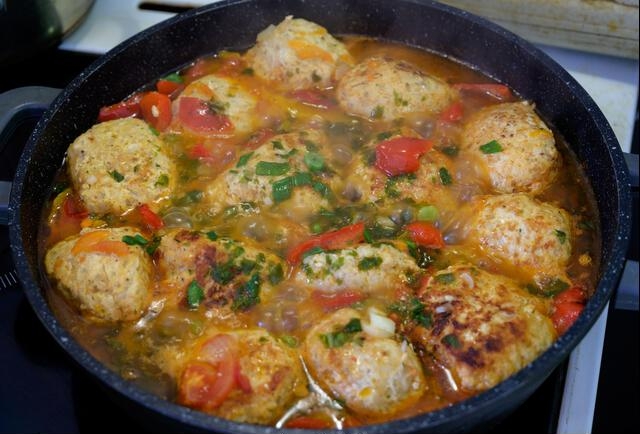 Homemade chicken cutlets are fried in a pan.