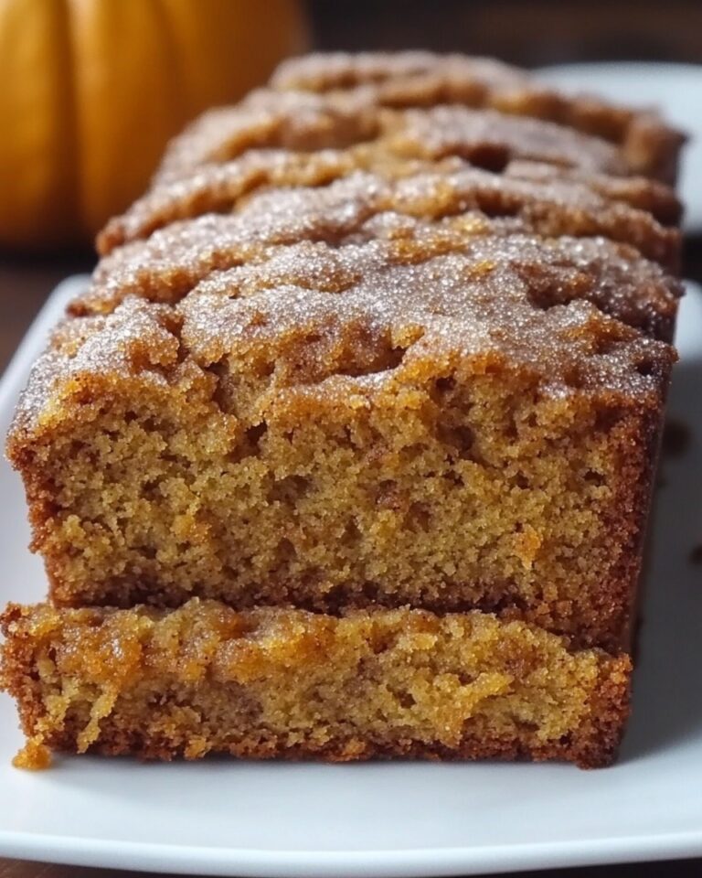 Enjoy the cozy flavors of Snickerdoodle Pumpkin Bread! This moist, spiced loaf is perfect for fall breakfasts, snacks, or dessert.